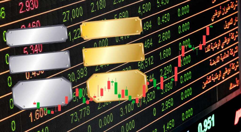 grafico di trading, lingottini di oro e di argento