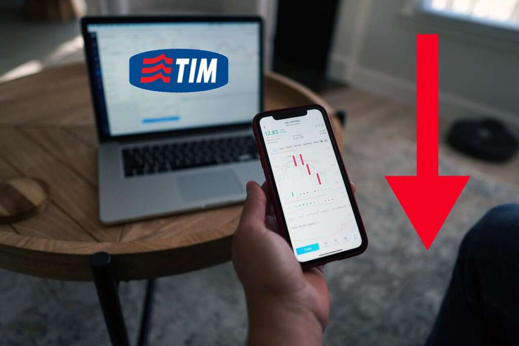trader con vari strumenti e logo di TIM su laptop