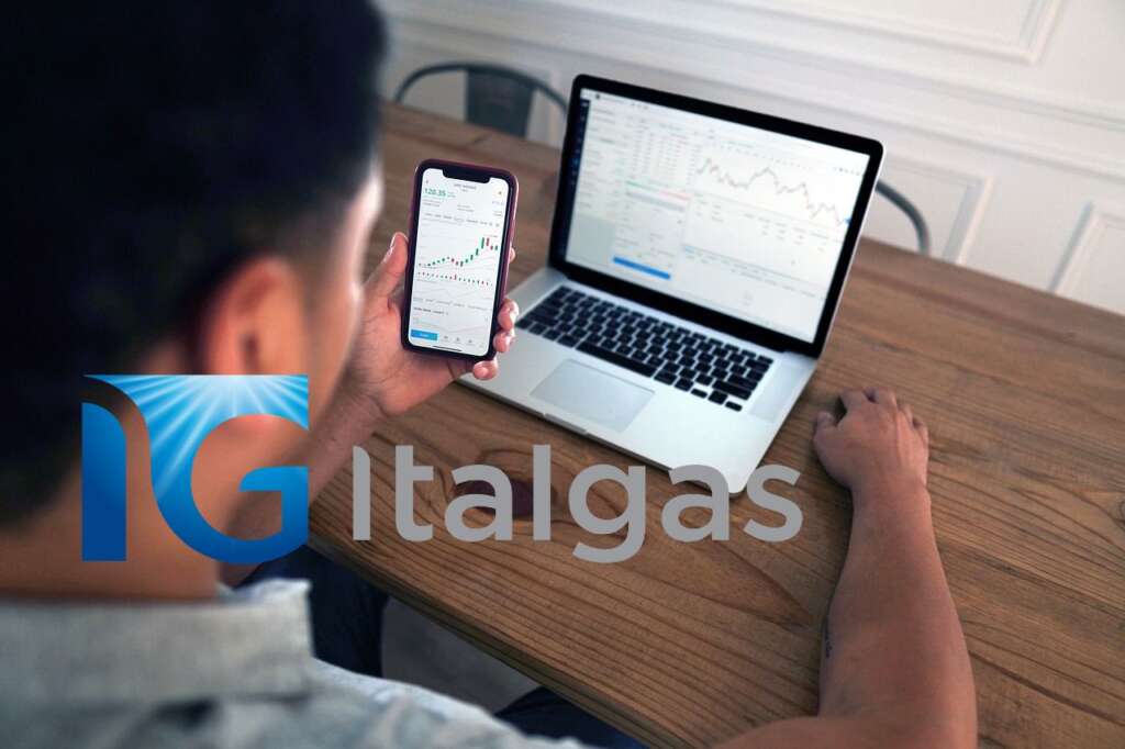 trader al lavoro e logo di Italgas