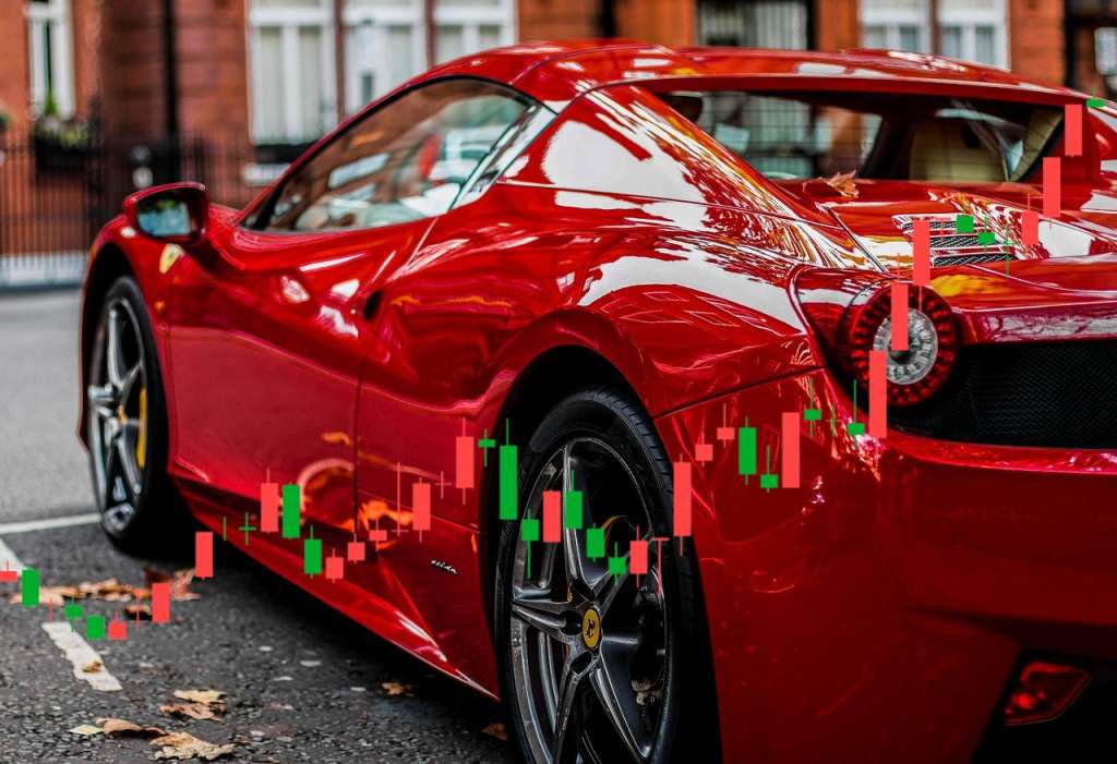 auto Ferrari e grafico di borsa